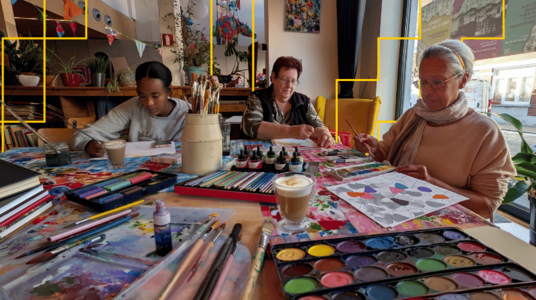 women painting and art materials